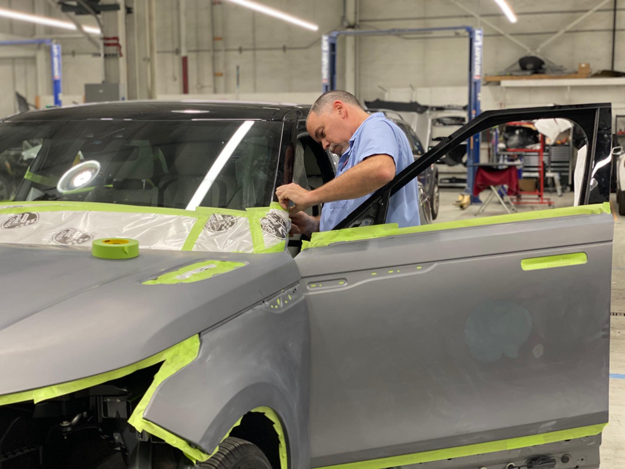 A person fixing a car.